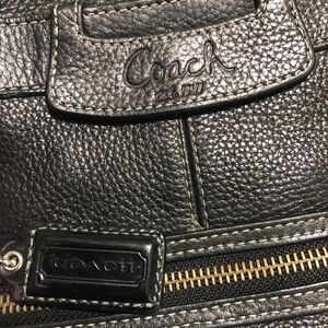 Coach black leather purse. Large purse with various compartments.
